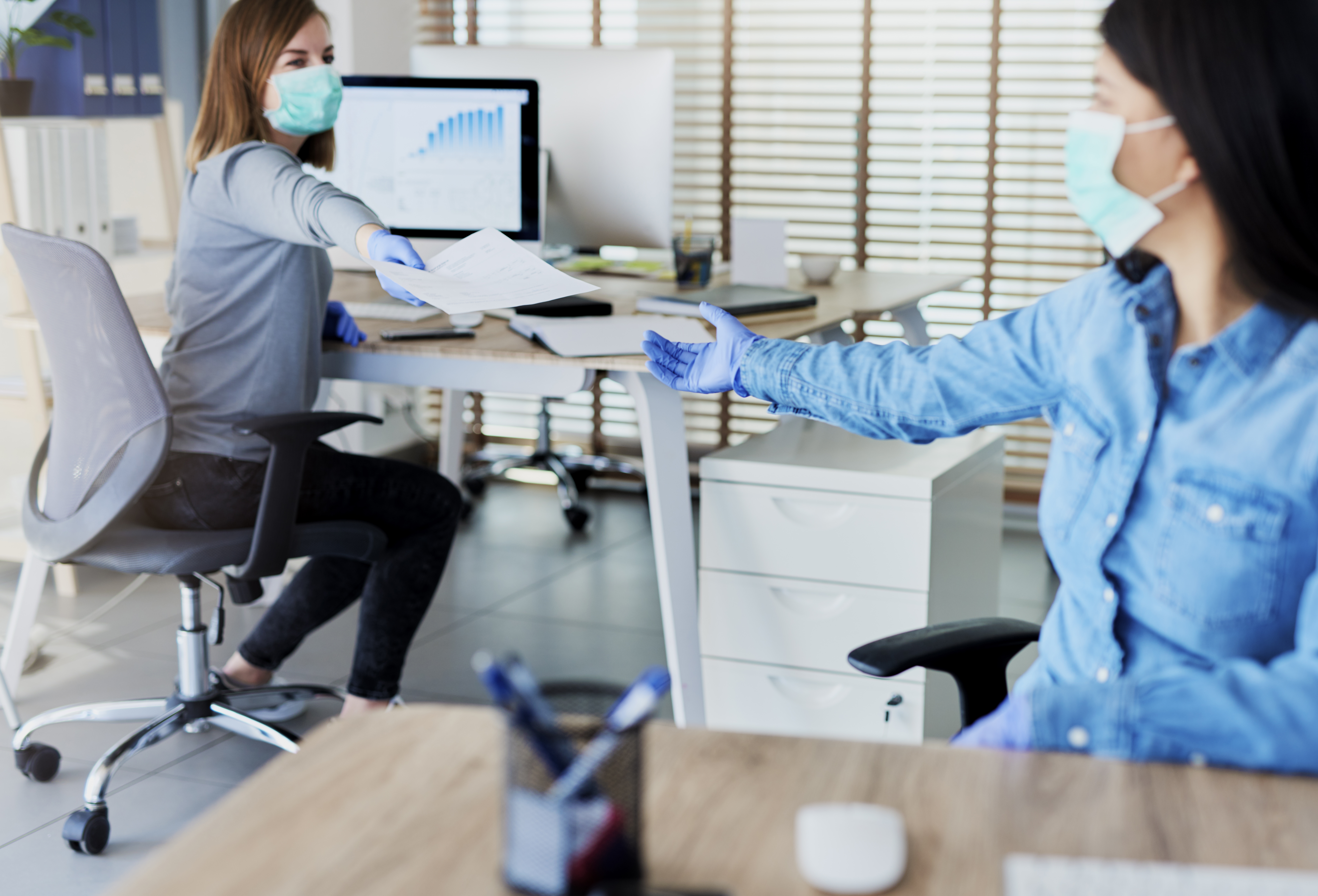 female employees back to work with masks on