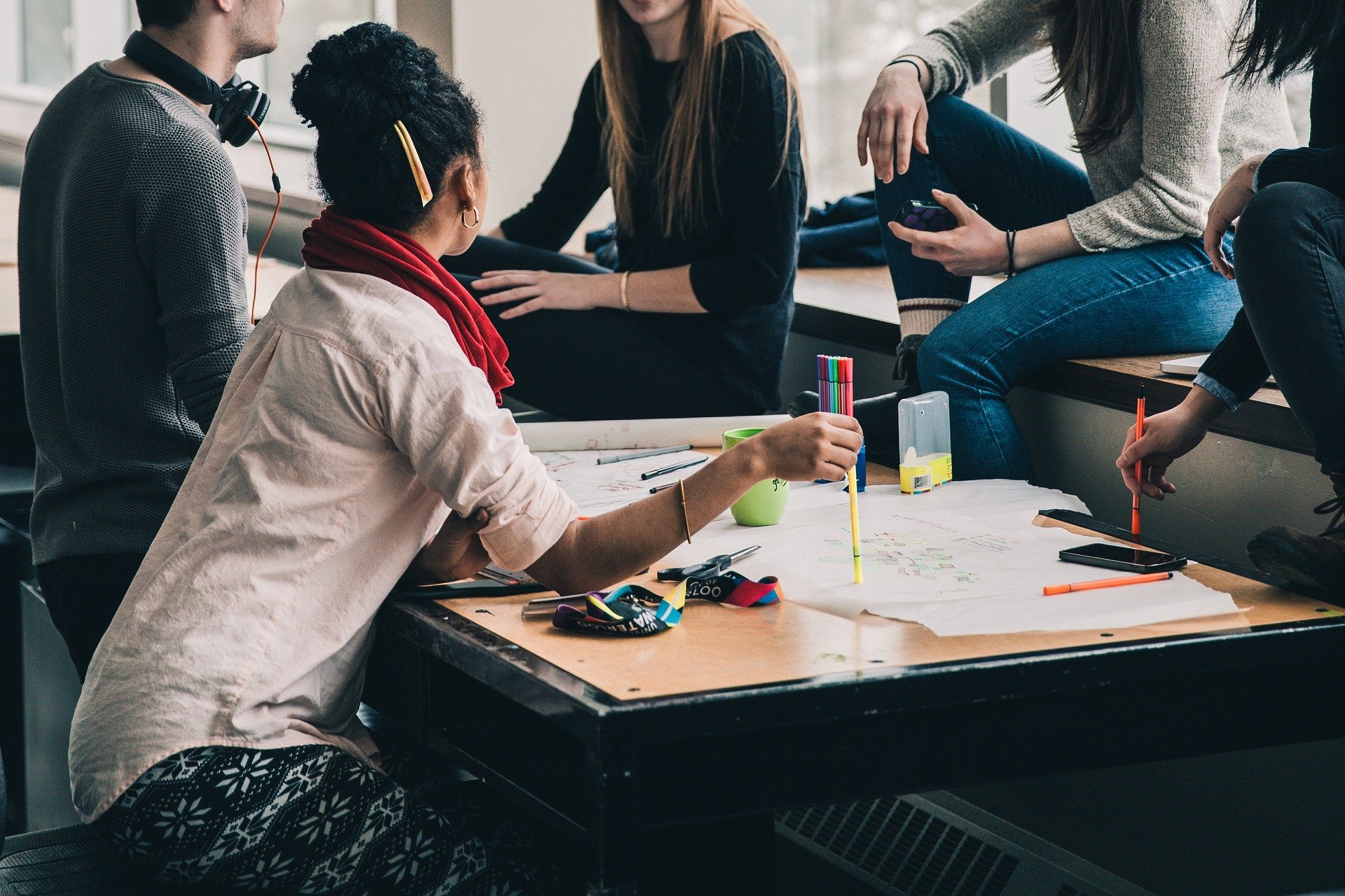students sitting at a desk